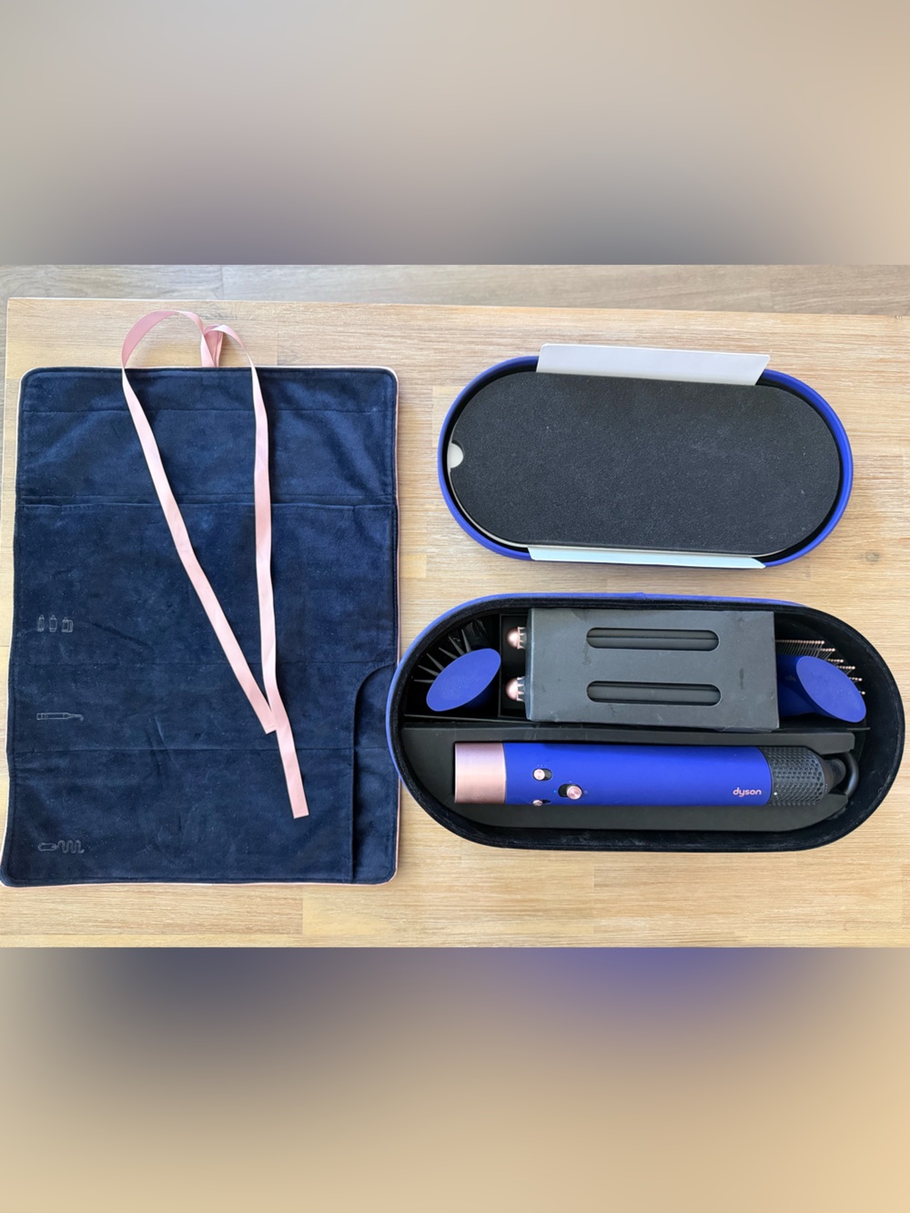 Dyson styling set in deep blue with rose gold accents